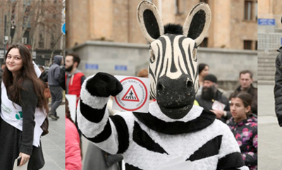 Superhero gives helping hand to Georgian pedestrians